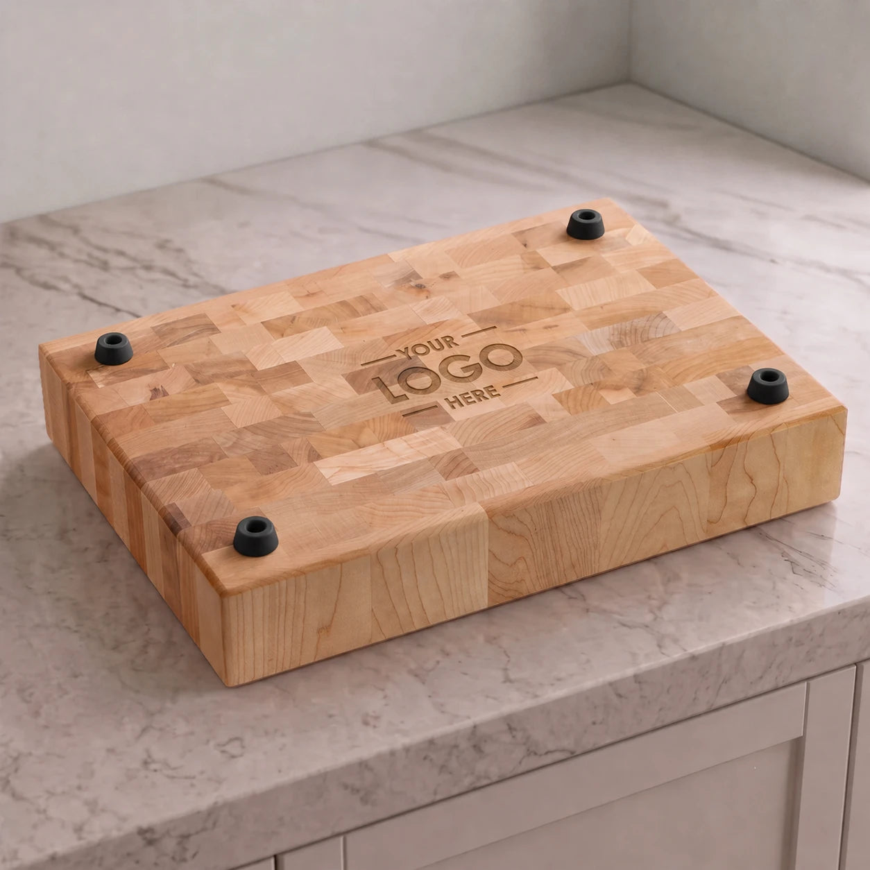 Underside maple cutting board logo placement mockup with four matte black rubber feet and Your Logo Here engraving